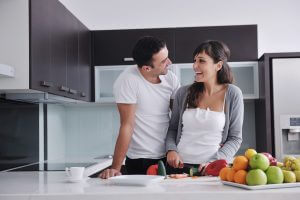 couple cooking in modern kitchen